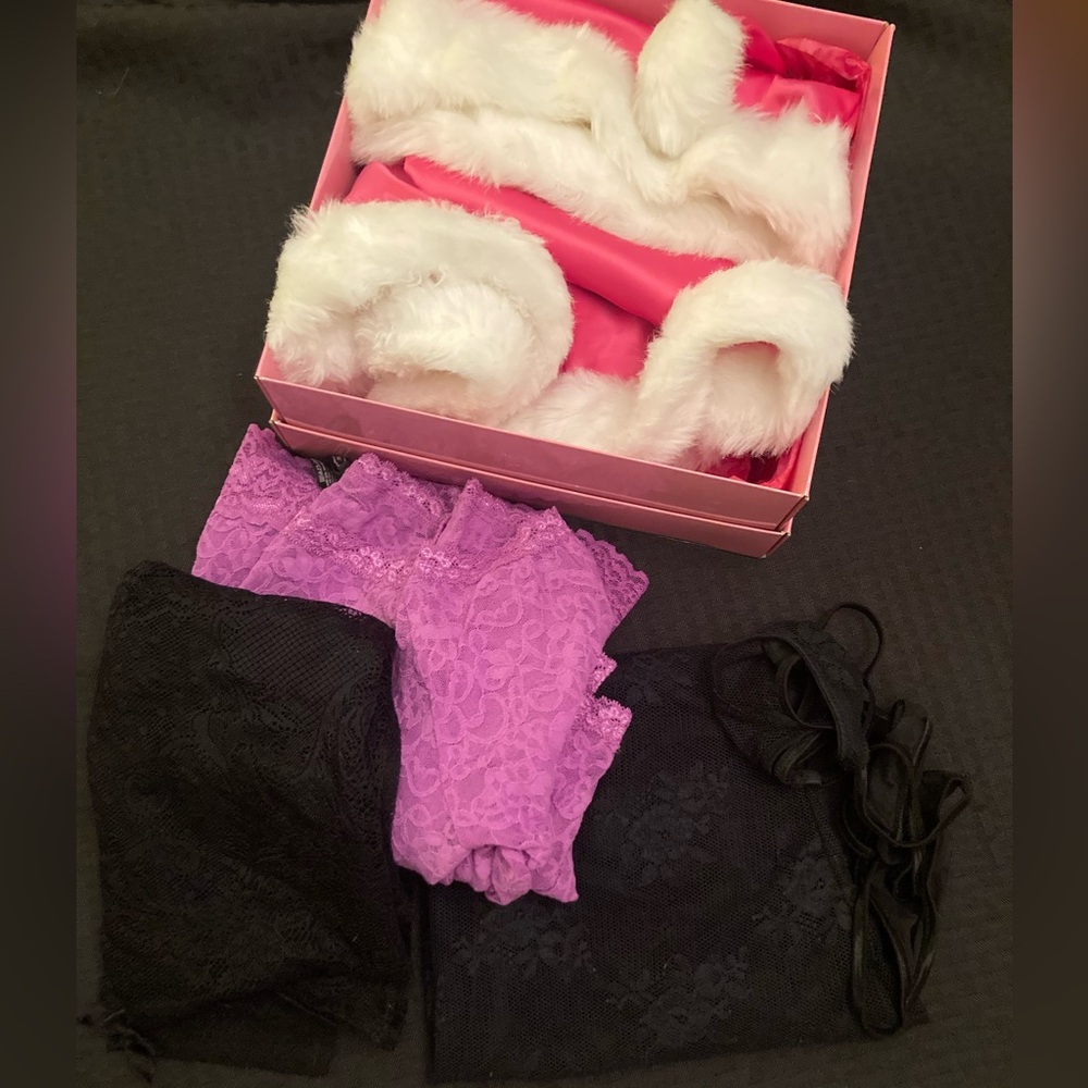 Box of assorted VS items and themed pink Santa accessories. Like new, size small